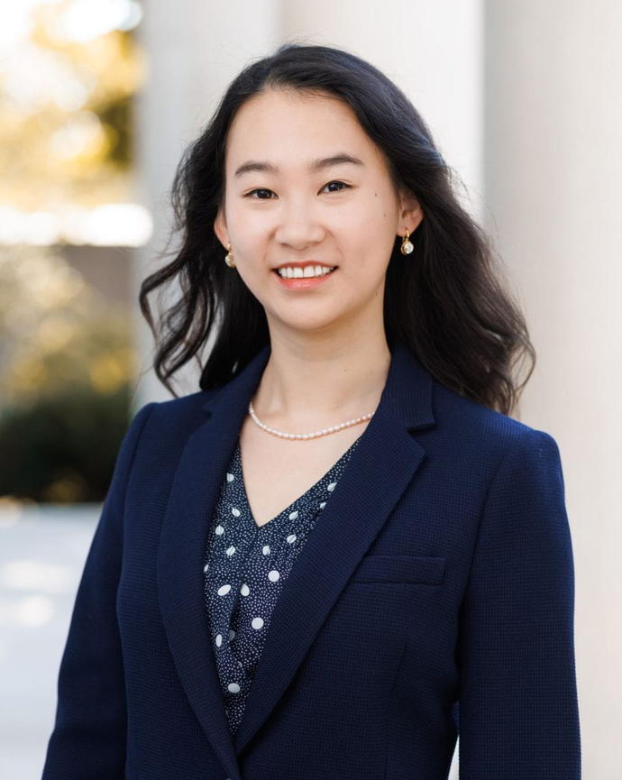 Claire Shi in front of the columns of Littauer Center